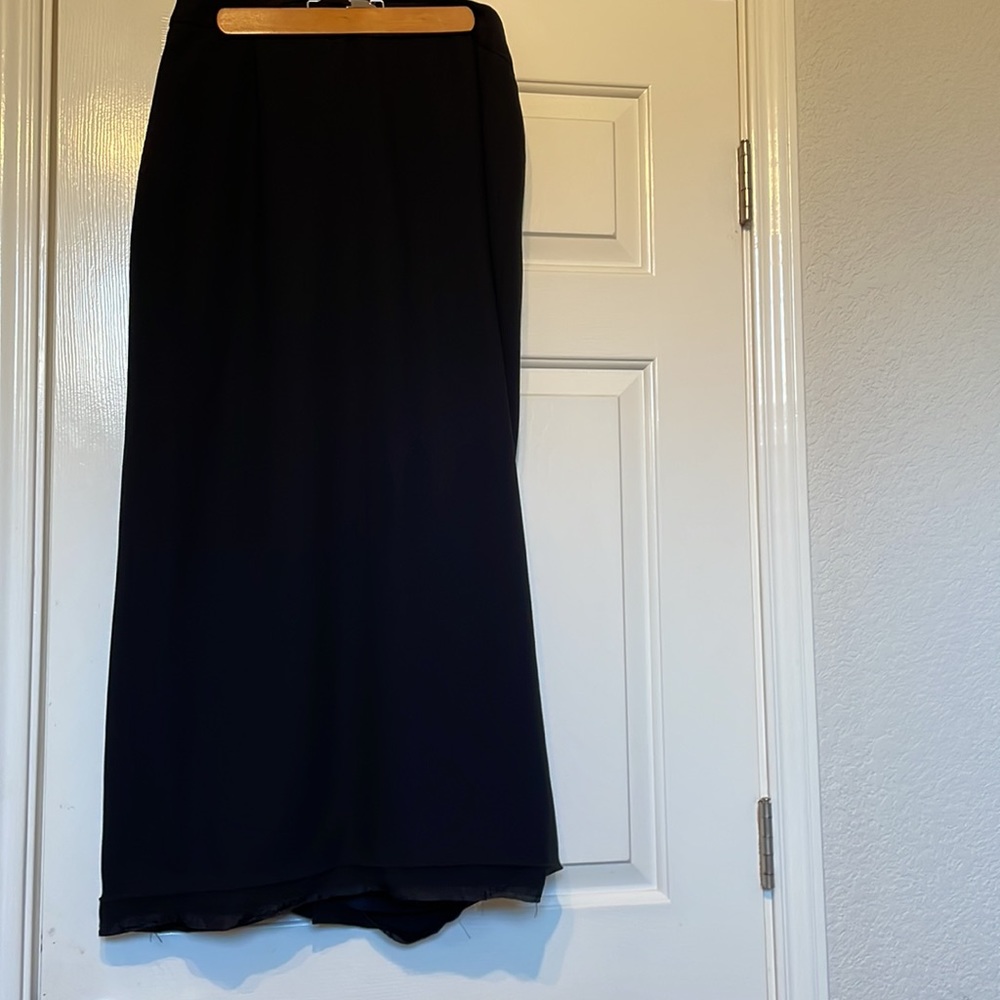 Peter Nygard 14 Black long skirt with slit in the back.